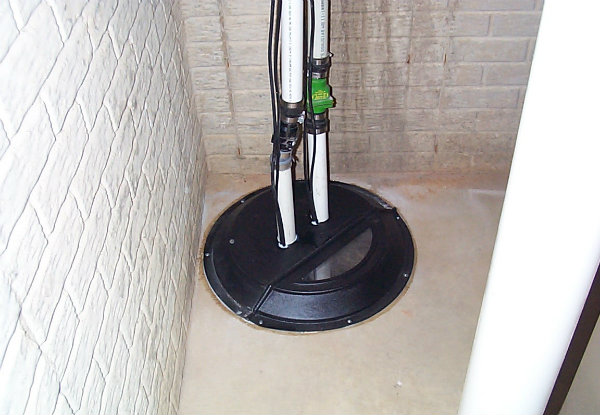 example photo of a sump pump in a basement